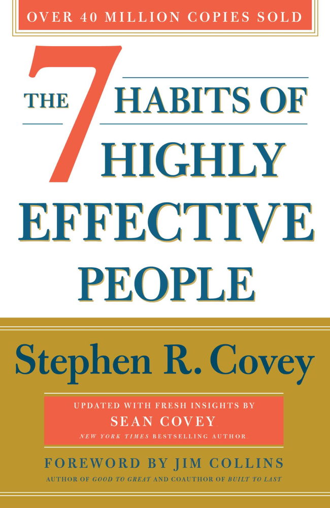 A book cover containing a black circle surrounding a black dot on a linen material.